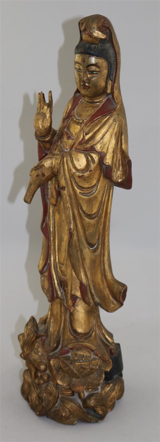 A late 19th century Chinese carved and giltwood figure of Guanyin, 20in.